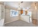 Open dining area with modern pendant lighting and a large window at 2177 Hidden Ranch Ter, Henderson, NV 89052