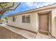 Charming front entrance with a welcome mat, and a view of the front windows at 2177 Hidden Ranch Ter, Henderson, NV 89052
