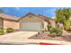 Single-story home featuring a two-car garage and desert landscaping at 2177 Hidden Ranch Ter, Henderson, NV 89052