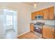 Updated kitchen featuring stainless steel appliances, gas range, and access to a laundry room at 2177 Hidden Ranch Ter, Henderson, NV 89052