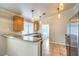 Functional kitchen with granite countertops, stainless steel appliances, and tile flooring at 2177 Hidden Ranch Ter, Henderson, NV 89052