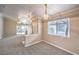Bright living area with seamless access to the outdoors and stylish lighting fixtures at 2177 Hidden Ranch Ter, Henderson, NV 89052