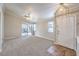 Open-concept living room with sliding glass doors to the backyard and tile entryway at 2177 Hidden Ranch Ter, Henderson, NV 89052