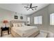 This main bedroom has a ceiling fan and crown molding, with windows bringing in natural light at 2177 Hidden Ranch Ter, Henderson, NV 89052