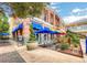 Vibrant shopping center with colorful awnings, outdoor seating, and a variety of shops and restaurants at 2177 Hidden Ranch Ter, Henderson, NV 89052