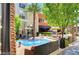 Lively community area with seating, a splash pad, and palm trees adding to the vibrant atmosphere at 2177 Hidden Ranch Ter, Henderson, NV 89052