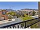 Beautiful townhome exterior with a private gated entry and desert landscaping in a quiet, well-maintained community at 23 Hudson Canyon St # 3, Henderson, NV 89012