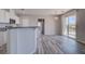 Bright and modern open concept kitchen has stainless appliances, and a stylish breakfast bar with patio access at 23 Hudson Canyon St # 3, Henderson, NV 89012