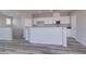 Open-concept kitchen with stainless appliances and breakfast bar offers seamless flow for living and entertaining at 23 Hudson Canyon St # 3, Henderson, NV 89012