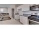 Beautiful kitchen with stainless steel appliances, white cabinets, and plenty of counter space for cooking and entertaining at 23 Hudson Canyon St # 3, Henderson, NV 89012