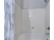 Shower over tub featuring white tub surround and a shower curtain at 23 Hudson Canyon St # 3, Henderson, NV 89012