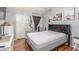 Bedroom features laminate flooring, a modern bed, and unique decor at 2725 S Nellis Blvd # 2168, Las Vegas, NV 89121