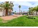 Community area features horseshoe pits, picnic tables, and a well-maintained tennis court at 2725 S Nellis Blvd # 2168, Las Vegas, NV 89121