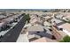 Aerial view of the neighborhood and rear exterior of the home, with tile roof and desert landscaping at 2905 Shimmering Bay St, Laughlin, NV 89029