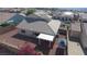 Aerial view of the backyard with mature landscaping, perimeter block wall, and covered patio at 2905 Shimmering Bay St, Laughlin, NV 89029