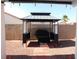 Backyard area with a gazebo and grill, perfect for outdoor cooking and entertaining at 2905 Shimmering Bay St, Laughlin, NV 89029