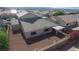 Aerial view of the backyard with mature landscaping, perimeter block wall, and covered patio at 2905 Shimmering Bay St, Laughlin, NV 89029