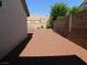 View of the backyard with desert landscaping, a brick wall and privacy fence at 2905 Shimmering Bay St, Laughlin, NV 89029