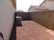 Backyard space featuring desert landscaping, privacy fencing and AC units at 2905 Shimmering Bay St, Laughlin, NV 89029