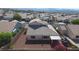 Aerial view of the backyard with mature landscaping, perimeter block wall, and covered patio at 2905 Shimmering Bay St, Laughlin, NV 89029
