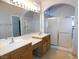 Bathroom with a double vanity and a glass shower at 2905 Shimmering Bay St, Laughlin, NV 89029