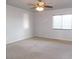 Bedroom featuring neutral paint, a ceiling fan, a window, and plush carpeting at 2905 Shimmering Bay St, Laughlin, NV 89029