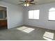 Bright bedroom featuring a ceiling fan and a window with natural light streaming in at 2905 Shimmering Bay St, Laughlin, NV 89029