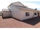 Exterior elevation showing a backyard view of this house and desert landscaping at 2905 Shimmering Bay St, Laughlin, NV 89029