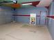 View of the garage featuring painted ceiling and walls, epoxy flooring, and a door to the inside of the home at 2905 Shimmering Bay St, Laughlin, NV 89029