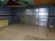 A spacious garage featuring custom flooring, storage cabinets and decorated ceiling at 2905 Shimmering Bay St, Laughlin, NV 89029