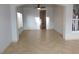 Open floor plan with neutral walls, tile flooring, a ceiling fan, and lots of natural light at 2905 Shimmering Bay St, Laughlin, NV 89029