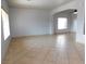 Bright living area features tile flooring, large windows, and neutral paint color at 2905 Shimmering Bay St, Laughlin, NV 89029
