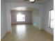 Bright living room featuring tile flooring and an archway at 2905 Shimmering Bay St, Laughlin, NV 89029