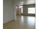 Bright living room with tile flooring, neutral paint, and view of the front door at 2905 Shimmering Bay St, Laughlin, NV 89029