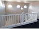 Bright staircase featuring white railing and natural light streaming through arched windows at 2905 Shimmering Bay St, Laughlin, NV 89029
