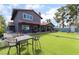 Backyard with artificial turf, patio area, and table with chairs provides a relaxing outdoor living space at 3400 Sioux Way, Las Vegas, NV 89169