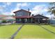 Expansive backyard with artificial turf, covered patio, and ample space for outdoor activities and relaxation at 3400 Sioux Way, Las Vegas, NV 89169