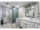 Bathroom featuring sleek sink with modern tiling in the shower, including a built-in niche at 3400 Sioux Way, Las Vegas, NV 89169
