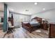 Bedroom featuring wood-look floors, a large window, and a decorative wood frame bed at 3400 Sioux Way, Las Vegas, NV 89169