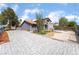 This Desert Modern home features interesting xeriscaping and a tiled roof at 3400 Sioux Way, Las Vegas, NV 89169