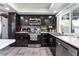 Dark-stained cabinets with plenty of storage, tile backsplash and ceramic tile floor at 3400 Sioux Way, Las Vegas, NV 89169