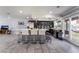 Open-concept kitchen with breakfast bar, ceramic tile and stainless steel appliances at 3400 Sioux Way, Las Vegas, NV 89169