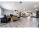 Spacious living room featuring tile floors, recessed lighting, and an open layout flowing into the kitchen at 3400 Sioux Way, Las Vegas, NV 89169