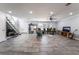 Open living room features stairs, recessed lighting, and a large window at 3400 Sioux Way, Las Vegas, NV 89169