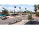 View from the balcony that overlooks the neighborhood featuring palm trees and mature landscaping at 3400 Sioux Way, Las Vegas, NV 89169