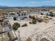 Sweeping aerial shot of the property showing the surrounding neighborhood and a very large lot at 3451 Sagebrush Ave, Pahrump, NV 89048