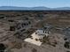 Aerial view of a property showcasing the home, grounds, and surrounding desert landscape at 3451 Sagebrush Ave, Pahrump, NV 89048