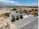 A home set in a large desert lot with a gravel front yard and a view of distant mountains at 3451 Sagebrush Ave, Pahrump, NV 89048