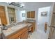 Bathroom featuring a single vanity, tile flooring, and a separate walk-in shower at 3451 Sagebrush Ave, Pahrump, NV 89048