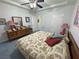 Comfortable bedroom with a tray ceiling and an assortment of decor at 3451 Sagebrush Ave, Pahrump, NV 89048